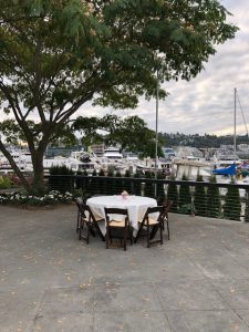 Outdoor Dockside Dining Table on Patio with Background Boats