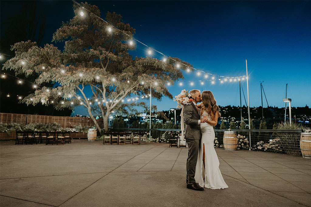 bride-and-groom-kissing-outside-dockside